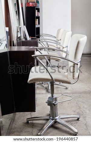Row of chairs in hair salon
