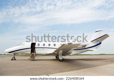 Business private jet parked at terminal