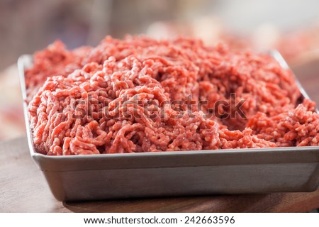 Closeup of tray filled with minced meat in butchery