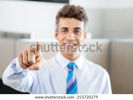 Portrait of confident manager pointing at you in call center