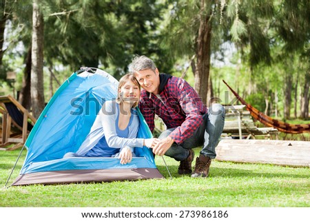 Portrait of romantic couple camping in park