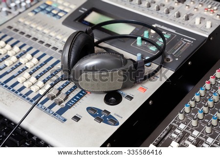 Closeup of headphones on music mixer in recording studio
