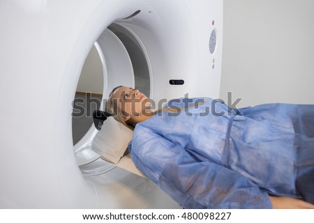 Patient Going Through CT Scan In Hospital