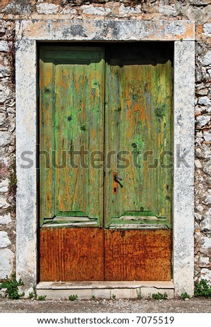 Old wooden door with fading paint