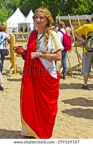 JUNE 6, 2015,  MOSCOW, RUSSIA - Festival of the historic reconstruction Times and Ages in the park Kolomenskoye. Young beautiful antic priestess