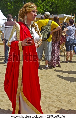 JUNE 6, 2015,  MOSCOW, RUSSIA -  Festival of the historic reconstruction Times and Ages in the park Kolomenskoye. Young beautiful antic priestess
