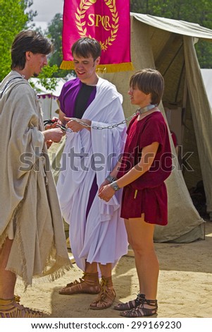 JUNE 6, 2015,  MOSCOW, RUSSIA - Festival of the historic reconstruction Times and Ages in the park Kolomenskoye. Scene with the young bondmaid and slave-trader