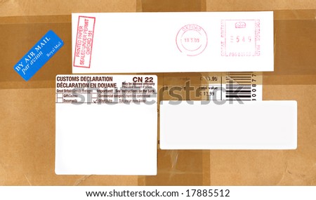 Airmail, postage and customs labels on a package from England.