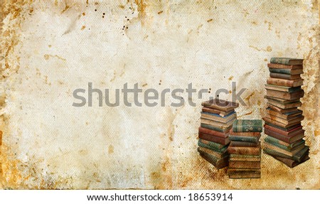 Stacks of antique books in the corner of a grunge background. Copy-space for your own text.