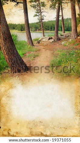 Wooded path by the lake on a grunge background with copy-space for your text.