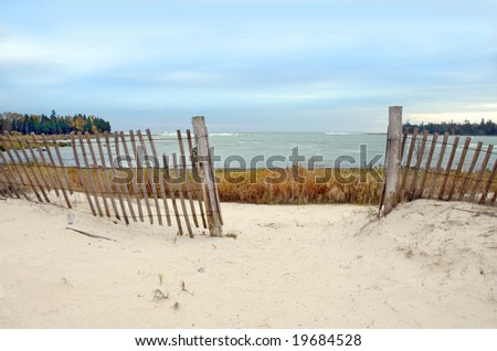 Fence on a beach in Door County, Wisconsin. Lake Michigan