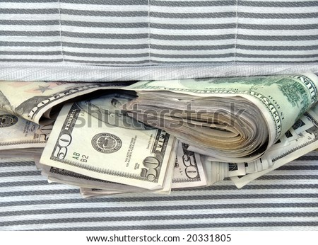 Cash stashed for safe keeping in between mattresses.