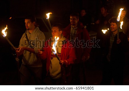 BUDAPEST, HUNGARY - NOVEMBER 12: Participants of the  torch-light procession, organized for the 375 anniversary of foundation of university on November 12, 2010 in Budapest, Hungary.