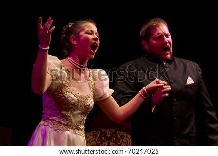 BUDAPEST, HUNGARY - JANUARY 30: Andras Barlay hungarian opera singer and Andrea Ujhelyi soprano on the stage of Merlin theater on January 30, 2011 in Budapest, Hungary.