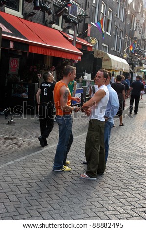 AMSTERDAM, NETHERLANDS - AUGUST 08: Unidentified people took part in the annual Amsterdam Gay Pride parade to support the LGBT rights, on august 8, 2004 in Amsterdam, Netherlands.