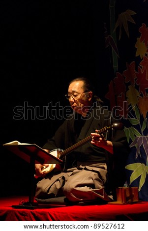 BUDAPEST, HUNGARY - NOVEMBER 22: Sekkyo Masadau, member of the japan Minwa Group plays on the Utsushi-e (Slide Show) presentation in the Merlin Theater on November 22, 2011 in Budapest, Hungary.