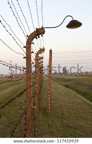 OSWIECIM, POLAND - OCTOBER 22: Electric fence in Auschwitz II, a former Nazi extermination camp on October 22, 2012 in Oswiecim. It was the biggest nazi concentration camp in Europe.