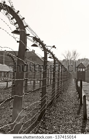 OSWIECIM, POLAND - OCTOBER 22: Barbed wire in Auschwitz Camp I, a former Nazi extermination camp on October 22, 2012 in Oswiecim, Poland. It was the biggest nazi concentration camp in Europe.