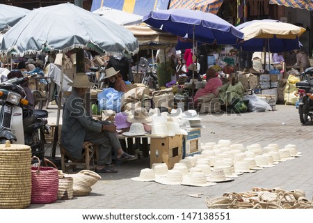MARRAKESH ,MOROCCO - JUNE 4: Unidentified people selling goods at a street in Marrakesh medina on June 4, 2013 in Morocco. In 2009 the medina got part of UNESCO World Heritage.