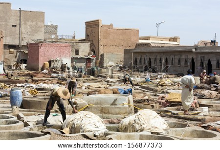 MARRAKESH, MOROCCO - JUNE 4: Unidentified people perform the work in tannery souk on June 4, 2013 Within Moroccos artisanal economy leather is the countrys largest export to partners (Spain, France)
