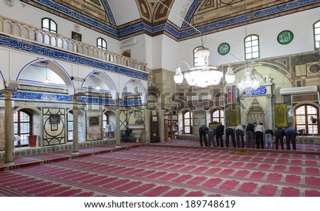ACRE, ISRAEL-DECEMBER 31 : Muslims pray inside the Acre Mosque on December 31, 2012 in Acre, Israel. The population of Acre is 30% muslim.