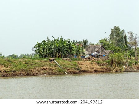 PREAEK TONLOAB COMMUNE, CAMBODIA - DECEMBER 31: Small house on the bank of Mekong river on December 31, 2013 near Phnom Phen, Cambodia.