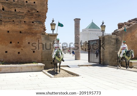 RABAT, MOROCCO - JULY 24 : Royal guard in front of the Hassan Tower and Mausoleum of Mohammed V. Mausoleum contains tombs of late King Hassan II and Prince Abdallah. On July 24, 2014 in Rabat, Morocco