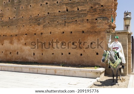 RABAT, MOROCCO - JULY 24 : Royal guard in front of the Hassan Tower and Mausoleum of Mohammed V. Mausoleum contains tombs of late King Hassan II and Prince Abdallah. On July 24, 2014 in Rabat, Morocco