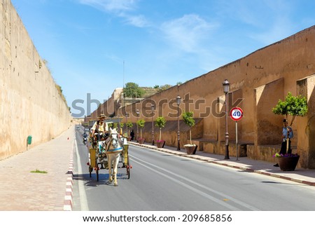 MEKNES, MOROCCO - JULY 24: Carriage at the wall of the Royal Palace on July 24, 2014 in Meknes, Morocco. Meknes is a 1000 years old imperial city.