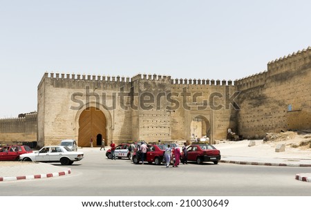 FEZ, MOROCCO - JULY 19: People at the entrance gate of the medina on July 19, 2014 in Fez, Morocco. The medina is listed as a UNESCO World Heritage Site.