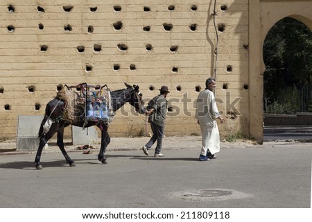FEZ, MOROCCO - JULY 19: People in the medina on July 19, 2014 in Fez, Morocco The medina is listed as a UNESCO World Heritage Site and is believed to be one of the world\'s largest car-free urban areas