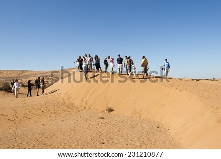 AGADIR, MOROCCO - NOVEMBER 2: Unidentified tourists visit the desert  on November 2, 2007 near Agadir, Morocco. Agadir is the premier tourist destination in the country.