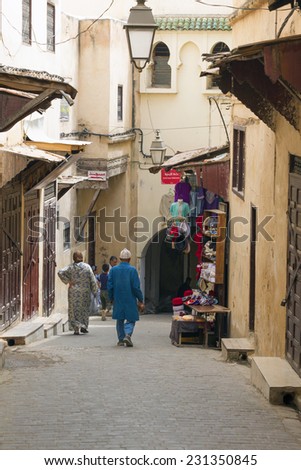 FEZ, MOROCCO - JULY 19: People in the medina on July 19, 2014 in Fez, Morocco.The medina is listed as a UNESCO World Heritage Site and is believed to be one of the world\'s largest car-free urban areas