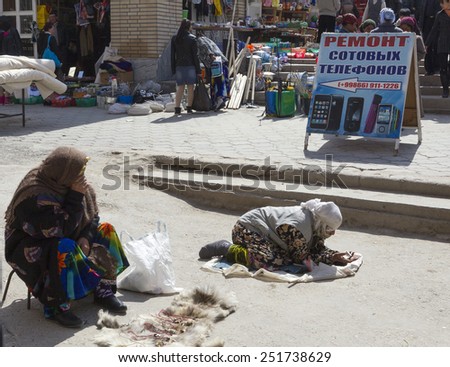 SAMARQUAND, UZBEKISTAN - MARCH 23: Unidentified beggar on the main market on March 23, 2012 in Samarquand, Uzbekistan. Begging is not legal but widely accepted in the country.