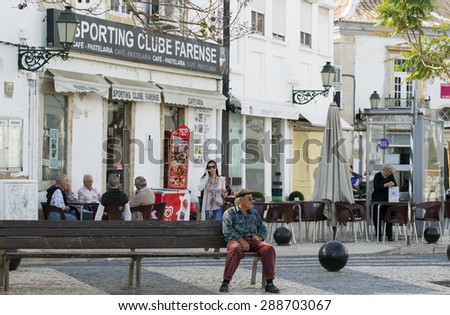 FARO, PORTUGAL - MAY 11. 2011: Unidentified people on the street of Faro city, the seat of the Faro District and capital of the Algarve region.