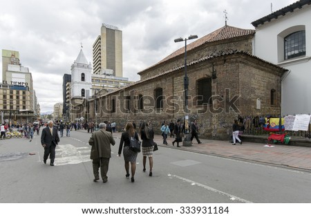 BOGOTA, COLOMBIA - OCTOBER 22, 2015: Unidentified people walking in disctrict of La Candelaria. La Candelaria the historic center of Bogota. Colombia\'s capital city was founded here in 1538