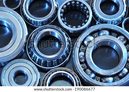 closeup view of several ball-bearings in blue light