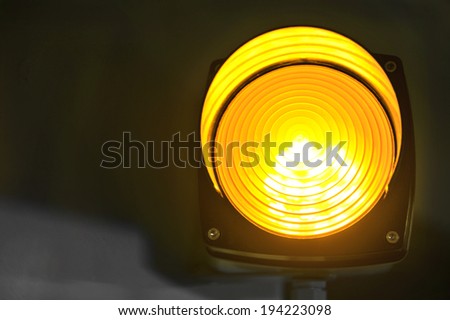 yellow glowing signal light