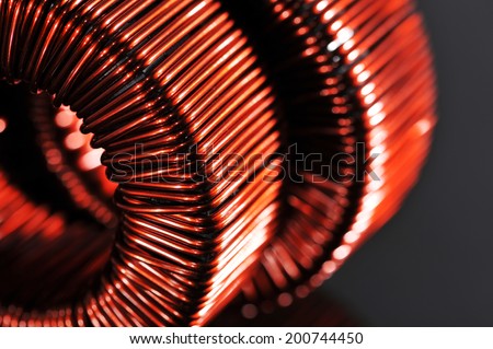 Macro detail of two copper inductors in a transformer