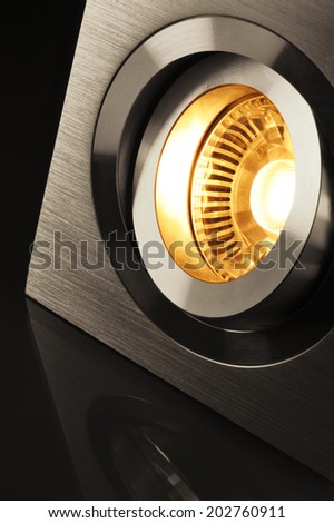 macro detail of a warmwhite COB-LED in aluminum lamp socket