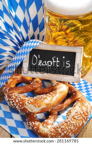 original bavarian salted soft pretzels with Oktoberfest beer mug and blackboard