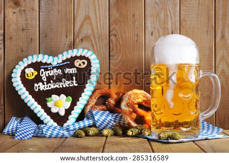 regards from the Oktoberfest - original bavarian gingerbread heart with Oktoberfest beer mug and soft pretzels from Germany