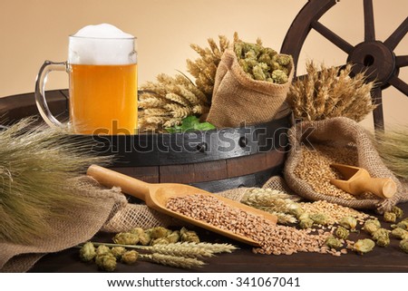 beer barrel, beer glass with hops, wheat, grain, barley and malt