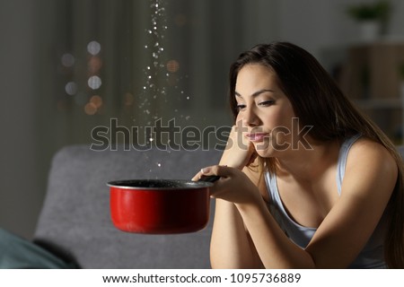 Desperate woman having water leaks sitting on a couch in the living room at home