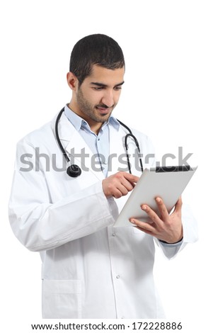 Arab Saudi doctor reading a tablet, isolated on a white background