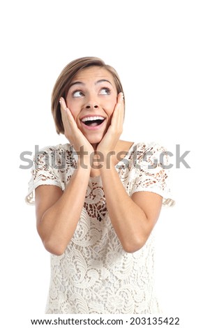 Happy shocked woman looking at side with hands on face isolated on a white background
