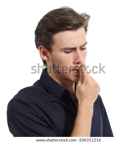 Young man stressed or worried biting nails isolated on a white background