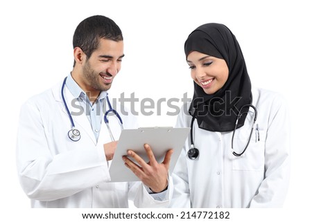 Arab saudi doctors reading together a medical history isolated on a white background