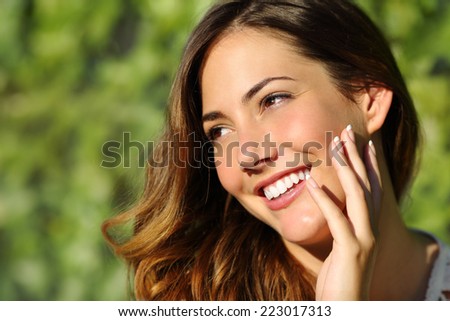 Beauty woman with a perfect smile and white tooth with a green background Beauty woman with a perfect smile and white tooth with a green background