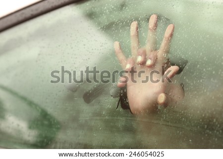 Couple holding hands having sex inside a car with a steamy window